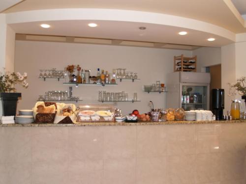 a kitchen with a counter with food on it at Iraklitsa Beach in Iraklitsa