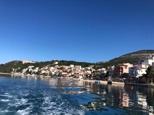 a town on the shore of a body of water at Holiday Home in Komarna