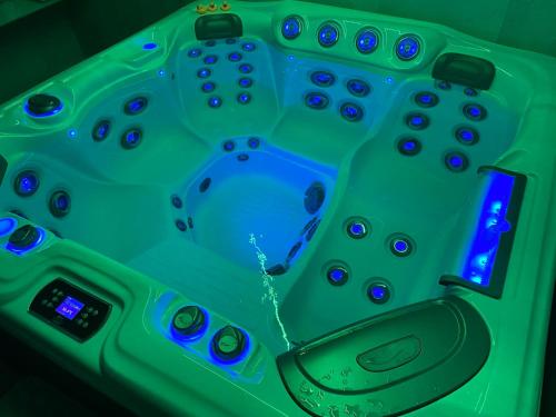 a remote control sitting on top of a green table at BALMA DEI CUP con SPA privata su richiesta in Pont Canavese