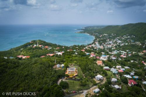 an aerial view of a town and the ocean at Belle View Apartment Villa - Cactus in Laborie