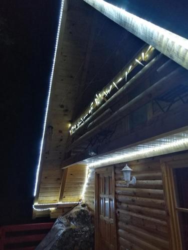 a row of lights on the side of a building at Brvnara Orfej in Gornje Pale