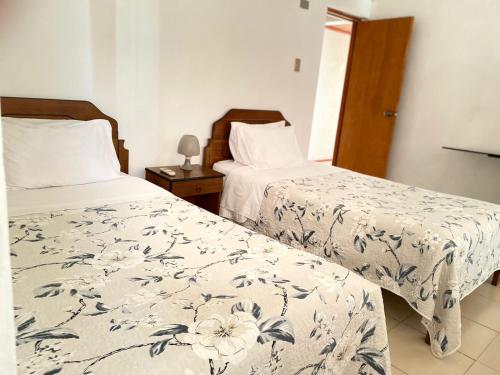 מיטה או מיטות בחדר ב-Hotel Vidal