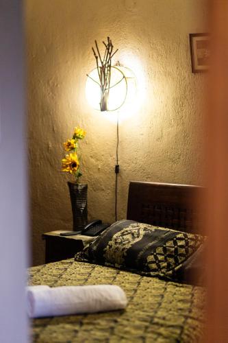 Una cama o camas en una habitación de La Moara Boutique Hotel