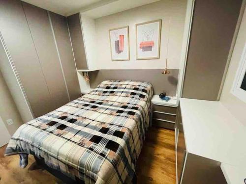 Una cama o camas en una habitación de Apartamento Acqua, 102 A, com vaga de garagem