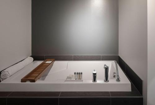 a bath tub in a bathroom with at Estérel Resort in Esterel