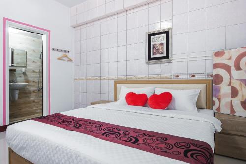 Una cama o camas en una habitación de Chaohai Homestay