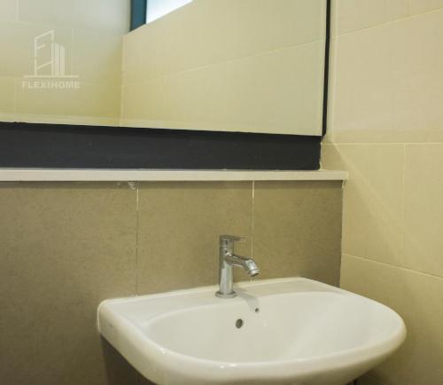 a white sink in a bathroom with a mirror at 9am-5pm, SAME DAY CHECK IN AND CHECK OUT, Work from Home, Comfy & Quiet Tamarind Suites-Cyberjaya by Flexihome-MY, in Cyberjaya