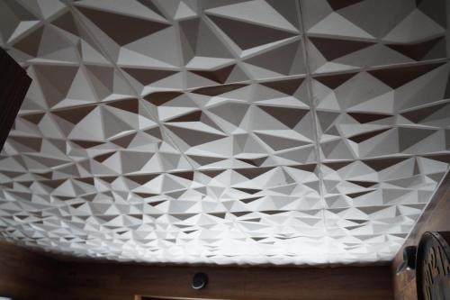 a ceiling with a geometric design on it at ROYAL SUITE TOTTO'NETTA 504 in Passo del Tonale