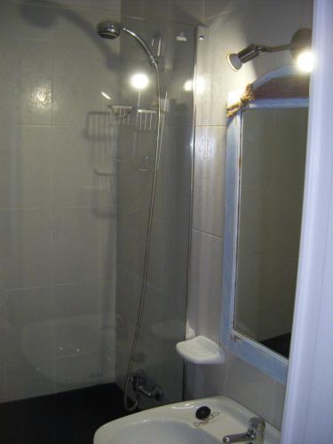 a bathroom with a shower and a toilet and a sink at Las Torres Del Castillo-120 Palms in Costa de Antigua