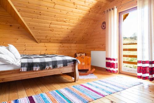 Tempat tidur dalam kamar di Bacówka na Kubanówce