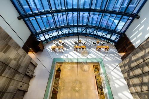 an overhead view of a room with tables and a ceiling at Millennium Place Mirdif in Dubai