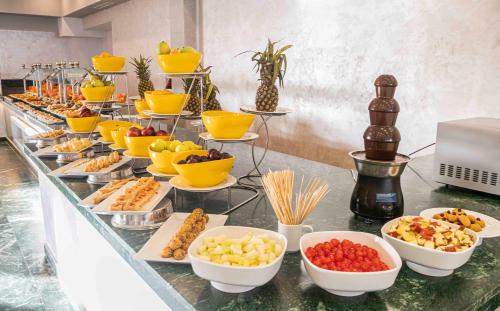 a buffet with different types of food on a table at Amarina Abu Soma Resort & Aquapark in Hurghada