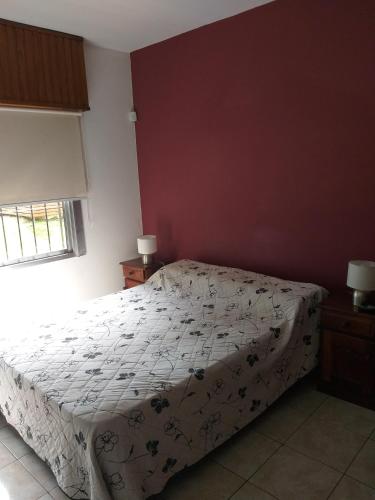 A bed or beds in a room at Alojamiento cerca de Ezeiza