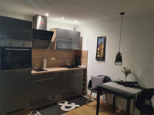 a kitchen with a sink and a counter top at Businessappartement Nr 2 in Worms