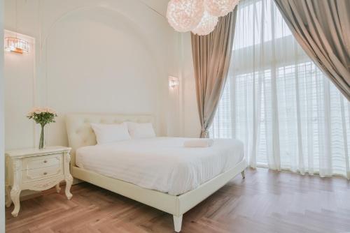 Postel nebo postele na pokoji v ubytování Nadda Pool Villa Ranong