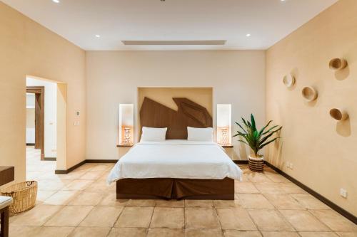 מיטה או מיטות בחדר ב-The Cliff Resort