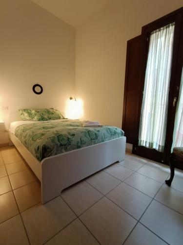 a bedroom with a bed with a lamp on it at LE GINESTRE in Sulmona