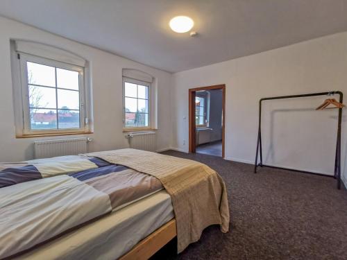 מיטה או מיטות בחדר ב-Apartment in Herrenhaus Groß Pinnow