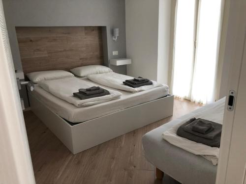 A bed or beds in a room at La Pineta Santa Maria Maggiore Locazione Turistica