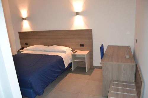 Una cama o camas en una habitación de Residence Vazzieri