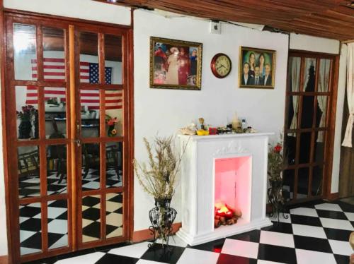 a living room with a fireplace with an american flag at Typical House Bluefields in Bluefields