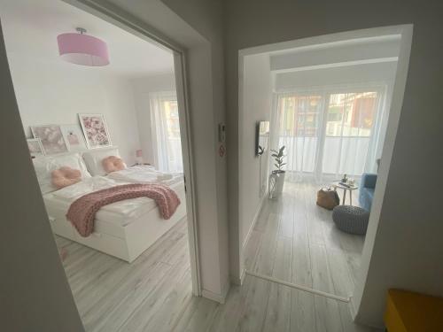 a bedroom with a bed and a large mirror at Apartament Nice Stay in Lubin