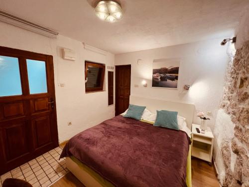 a bedroom with a large bed in a room at Guesthouse F in Split