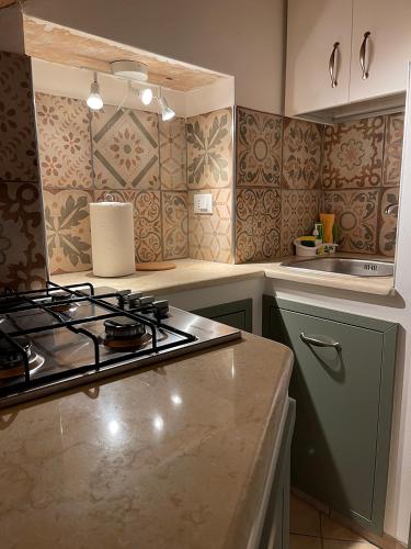a kitchen with a stove and a counter top at B&B Sacca in Lanciano