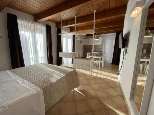 a bedroom with a bed and a dining room at B&B Sacca in Lanciano
