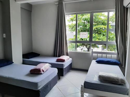 Ένα ή περισσότερα κρεβάτια σε δωμάτιο στο SAXÔNiA HOTEL