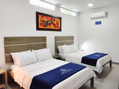 Postel nebo postele na pokoji v ubytování Hotel Boutique San Rafael