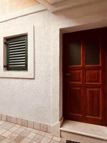 a door and a window on a building at Guesthouse F in Split