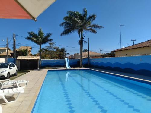 Kolam renang di atau dekat dengan Casa Unamar Verão Vermelho Cabo Frio