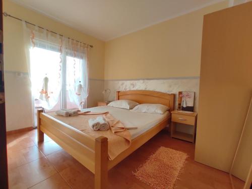 Postel nebo postele na pokoji v ubytování Apartmani Tomić 4*