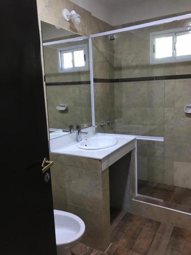 a bathroom with a sink and a shower and a toilet at Casablanca in Victoria