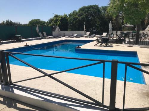 a swimming pool with a fence around it at Casablanca in Victoria