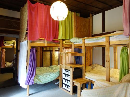 Postel nebo postele na pokoji v ubytování The Otaornai Backpacker's Hostel Morinoki