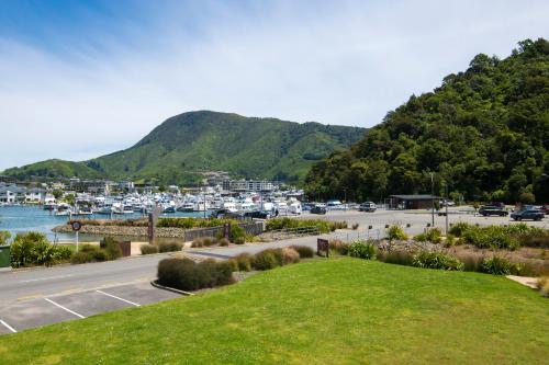 a parking lot with a bunch of boats in a harbor at Boathouse Apartments in Picton