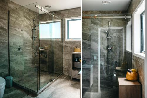 a bathroom with a shower with a glass door at Boathouse Apartments in Picton