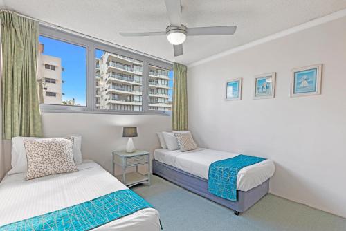 Postel nebo postele na pokoji v ubytování Northwind Beachfront Apartments