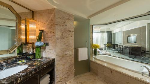 a bathroom with a tub and a sink at InterContinental Chengdu Global Center, an IHG Hotel in Chengdu