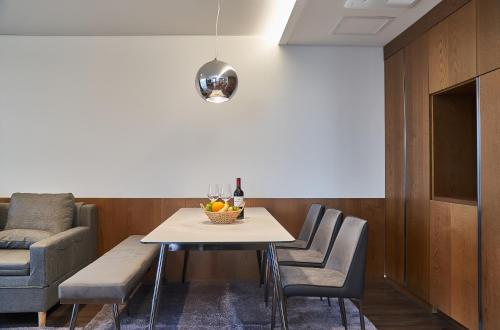 a dining room with a table and chairs at JN PARK Hotel in Incheon