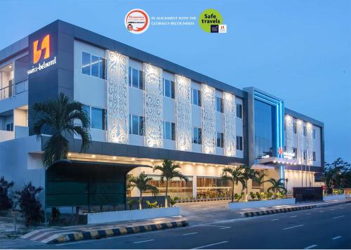 a rendering of a building on a street at Swiss-Belhotel Cendrawasih, Biak in Fandoi