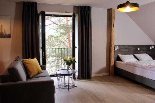 Ένα ή περισσότερα κρεβάτια σε δωμάτιο στο Garden Loft
