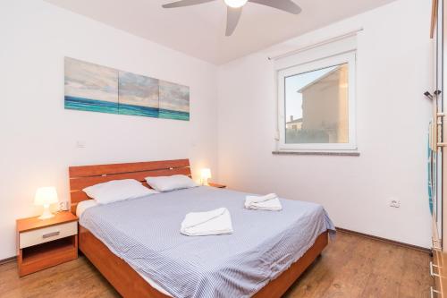 Ένα ή περισσότερα κρεβάτια σε δωμάτιο στο MARINA VIEW APARTMENT