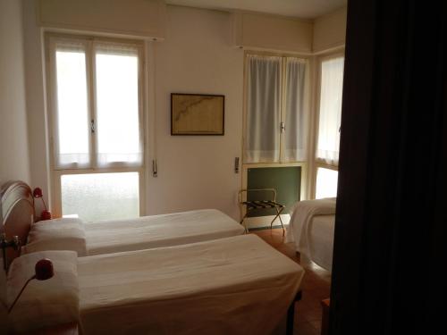 Ένα ή περισσότερα κρεβάτια σε δωμάτιο στο Hotel Miriam