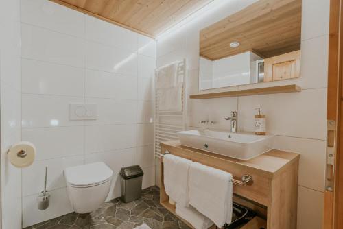 a bathroom with a sink and a toilet at Gästehaus Ilishof in Schruns