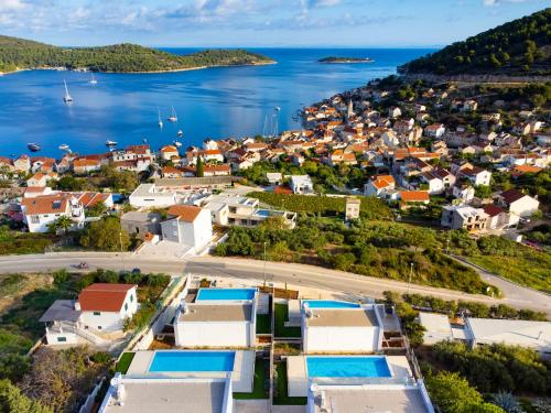 an aerial view of a small town next to the water at Luxury Blue Villas Vis in Vis