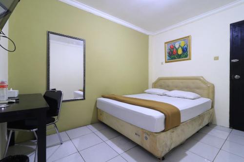 Katil atau katil-katil dalam bilik di AMS Hotel Koja