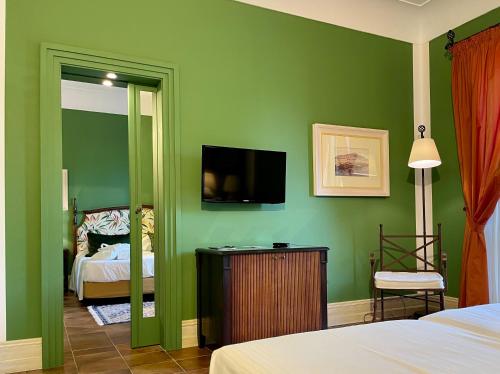 Postel nebo postele na pokoji v ubytování Hotel Baglio Oneto dei Principi di San Lorenzo - Luxury Wine Resort